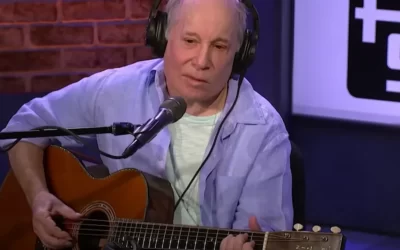 Paul Simon demonstrates his Travis picking style on acoustic guitar: “The thumb is always moving”